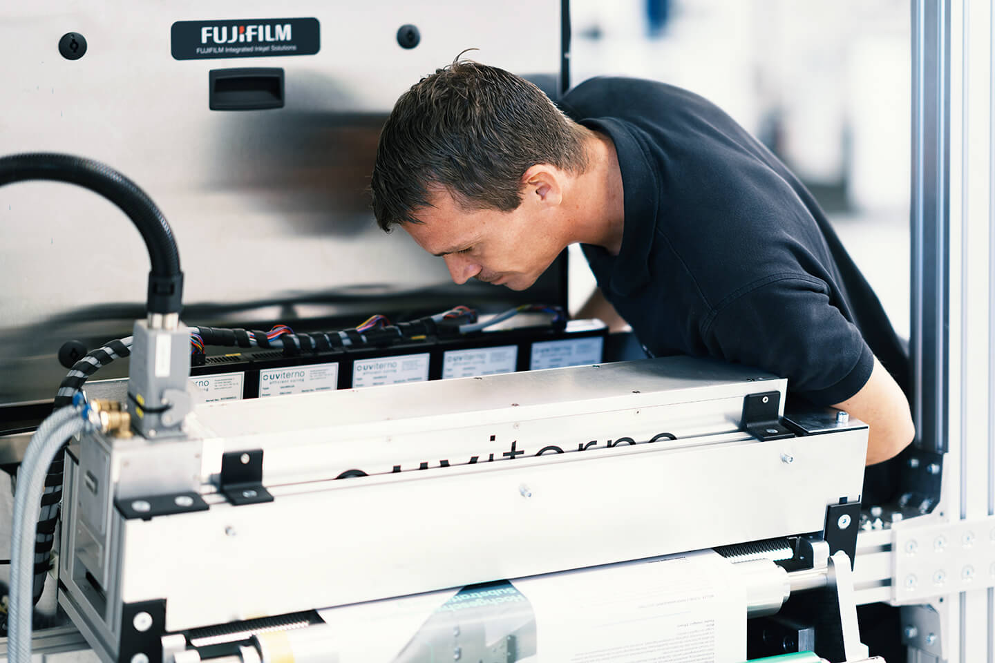 Fujifilm Dimatix repair technician working on a print system. 